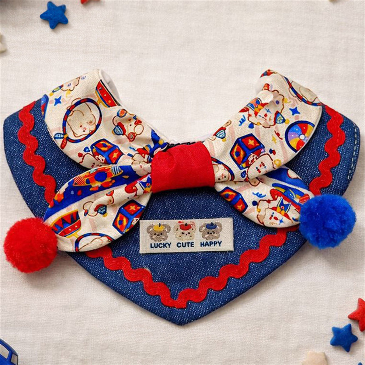 AI-cleaned product photo: close-up of the Circus Bear bow and pompoms