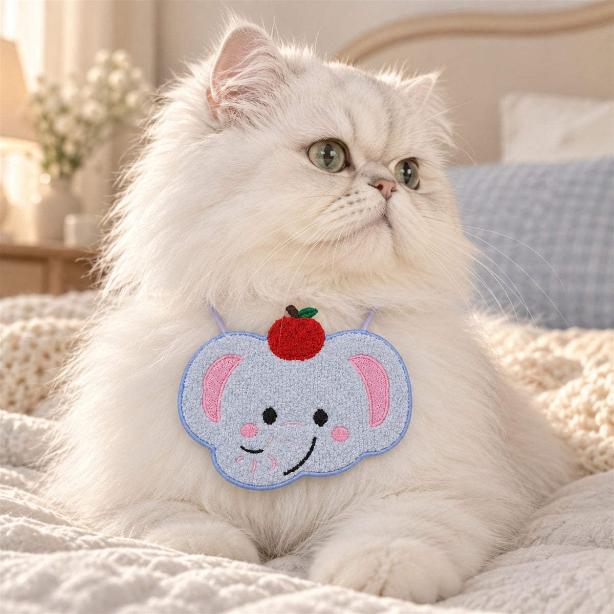 AI-generated preview: white Persian cat wearing the Apple Elephant bib