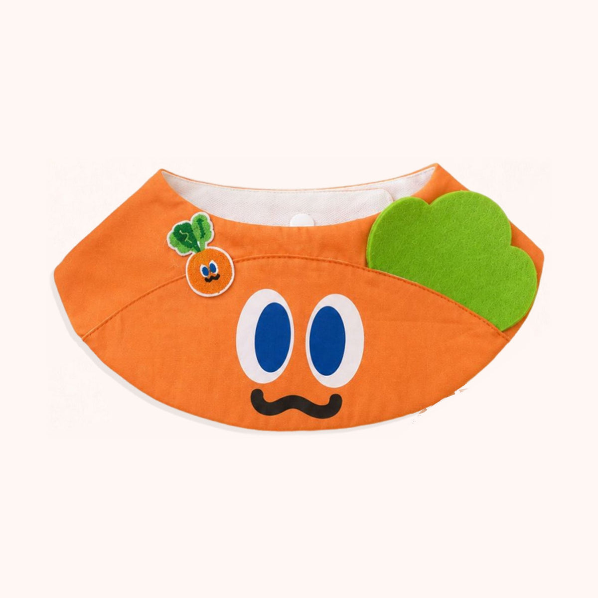 AI-cleaned product photo: Orange Buddy pet bib, bright orange with big eyes, a moustache and a green leaf
