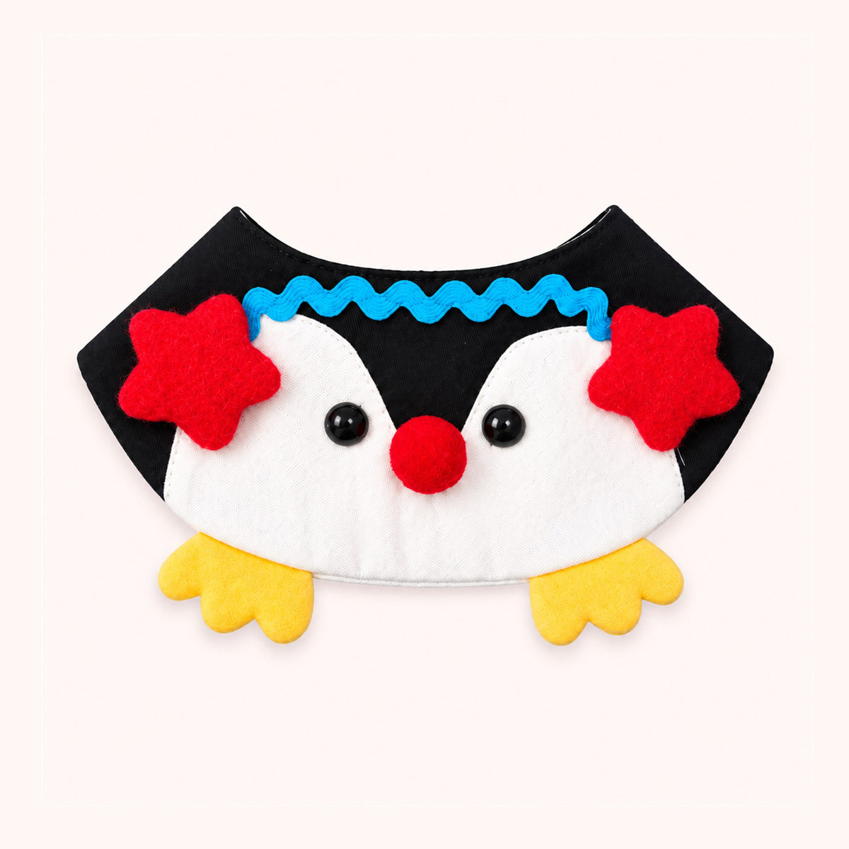 AI-cleaned product photo: Little Penguin pet bib, black and white penguin with red stars and yellow feet