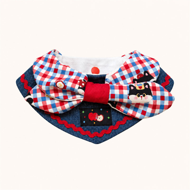 AI-cleaned product photo: Apple Cat big bow pet bib, blue-and-red check bow with a little cat patch