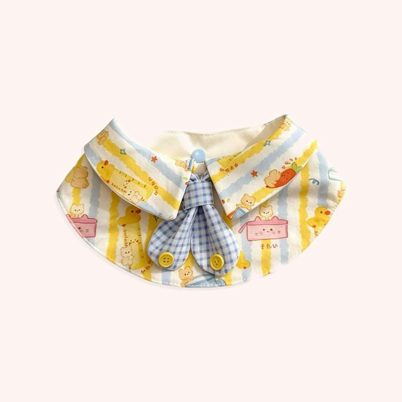 Product photo: Butter Duck Bow Pet Bib — Buttery duck-and-bunny print collar with a blue gingham bow.