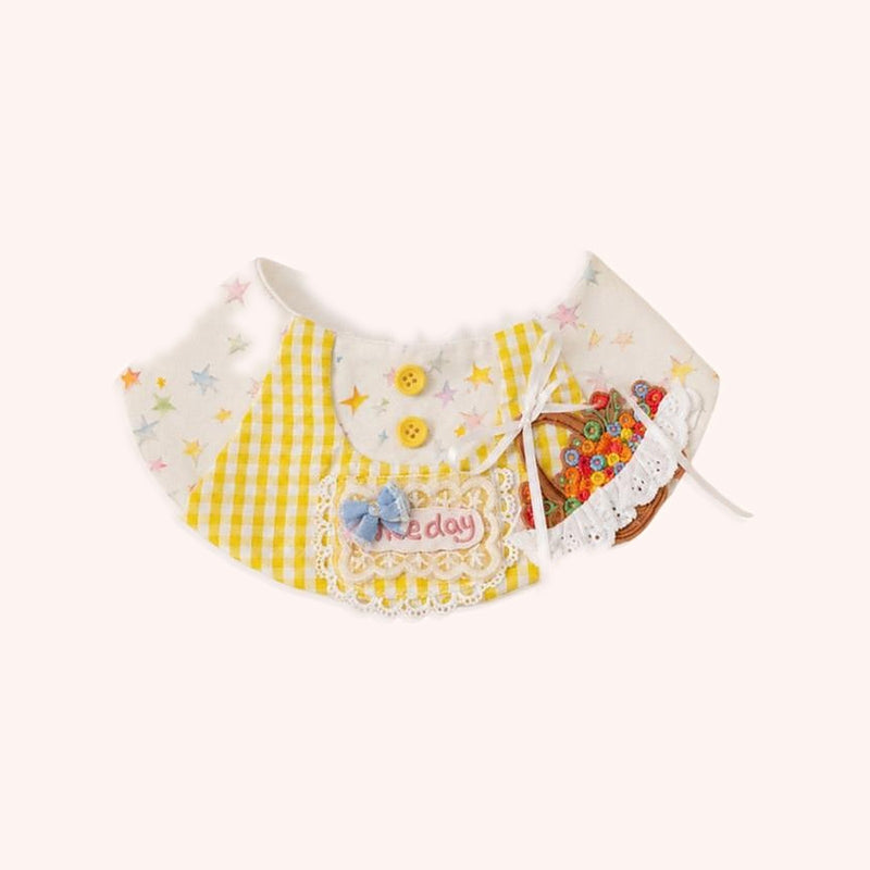 Product photo: Little Florist Pet Bib — Yellow gingham bib with a starry collar, lace trim, a blue bow and an embroidered flower basket.