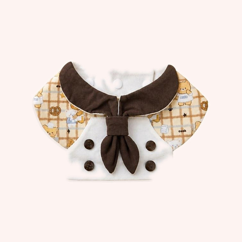 Product photo: Little Cook Bear Pet Bib — Bear-and-pretzel plaid bib with a chocolate sailor collar and a double-breasted chef front.