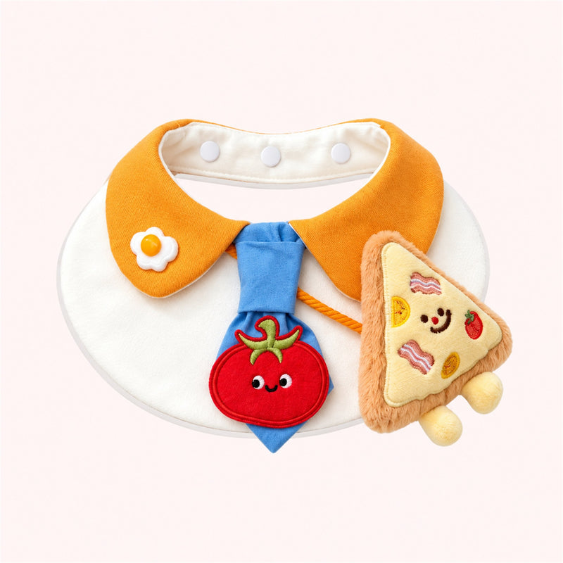 AI-cleaned product photo: Mini Pizza Pet Bib — Orange collar, blue tie with a smiling tomato, fried-egg pin and a plush pizza slice.