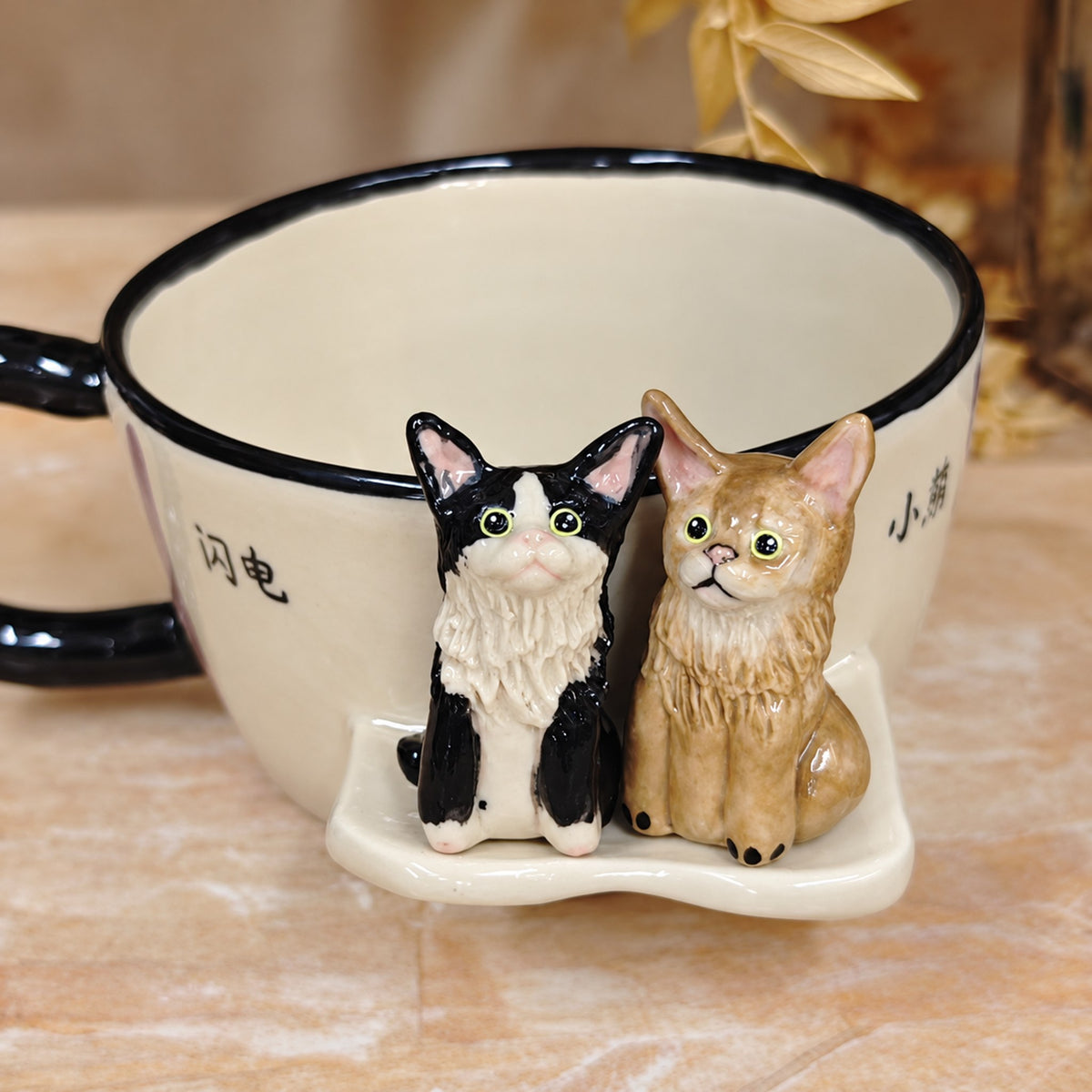 AI-cleaned product photo: Sitting outside pose, two sculpted cats on the side of the mug