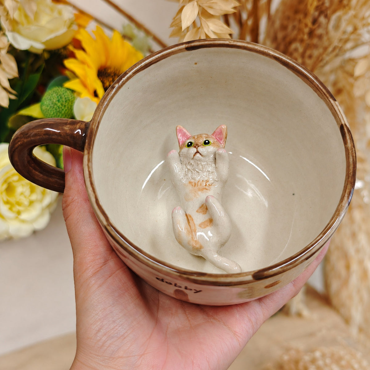 AI-cleaned product photo: Lying inside pose, sculpted cat lying inside the mug